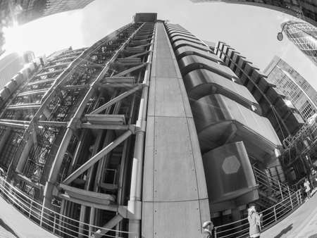 LONDON, UK - SEPTEMBER 29, 2015: Lloyd of London is an iconic high tech skyscraper designed by architect Richard Rogers seen with fisheye lens in black and whiteのeditorial素材