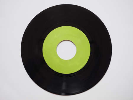 Single vinyl record vintage analog music recording medium 45 rpm green labelの写真素材