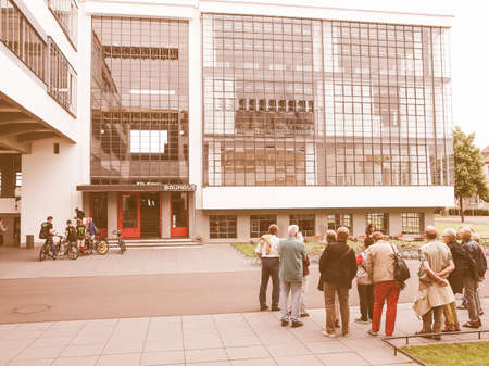 DESSAU, GERMANY - JUNE 13, 2014: Visitors on an official guided tour of the Bauhaus building vintageのeditorial素材