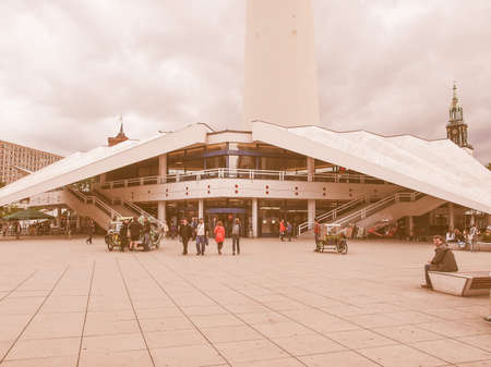 BERLIN, GERMANY - MAY 08, 2014: Turists visiting Alexander Platz, the central square in East Berlin, which was designed by German architect Peter Behrens vintageのeditorial素材