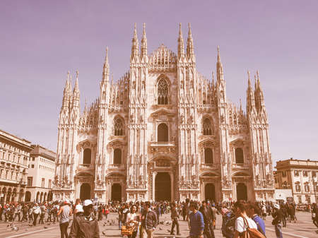 MILAN, ITALY - APRIL 10, 2014: Tourists visiting the Piazza Duomo square in Milan Italy vintageのeditorial素材