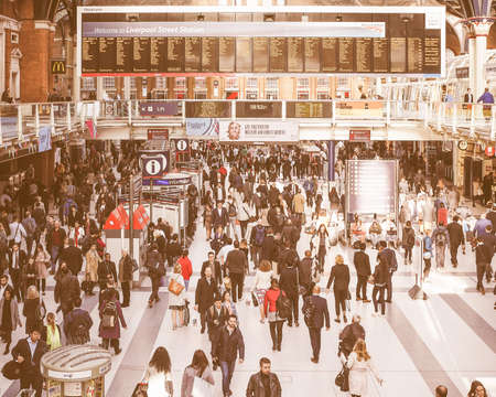LONDON, UK - SEPTEMBER 28, 2015: Travellers at Liverpool Street Station vintageのeditorial素材