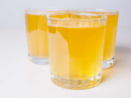 Glasses of pineapple juice on continental breakfast tableの写真素材