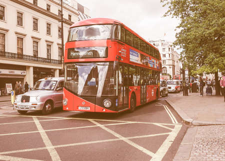 LONDON, UK - JUNE 09, 2015: Red double decker buses are a traditional landmark of London vintageのeditorial素材