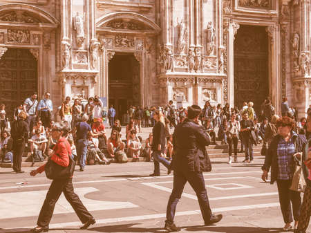 MILAN, ITALY - APRIL 10, 2014: Tourists visiting the Piazza Duomo square in Milan Italy vintageのeditorial素材