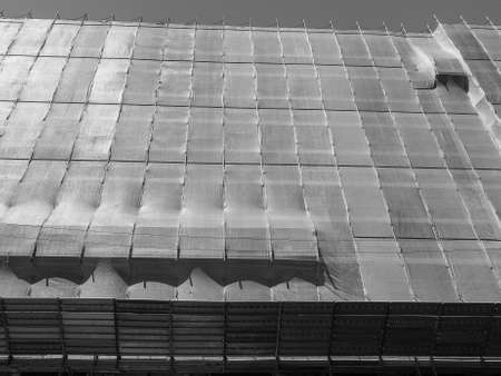 Temporary scaffold for construction works at building site in black and whiteの写真素材