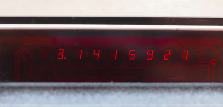 Pi constant on an LCD display of a scientific electronic pocket calculatorの写真素材