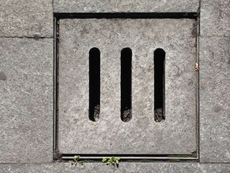 Detail of a manhole in the streetの写真素材