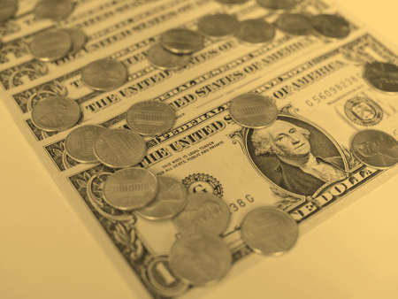 One cent coins and One Dollar banknotes  currency of the United States useful as a background -...