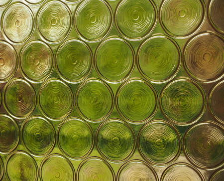 Greenery seen through decorated glass useful as a backgroundの写真素材