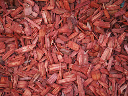 Red wood chip texture useful as a backgroundの写真素材