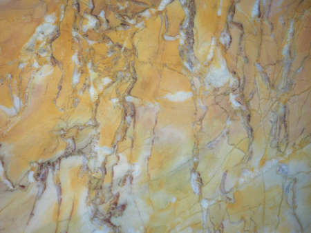 Yellow marble texture useful as a backgroundの写真素材