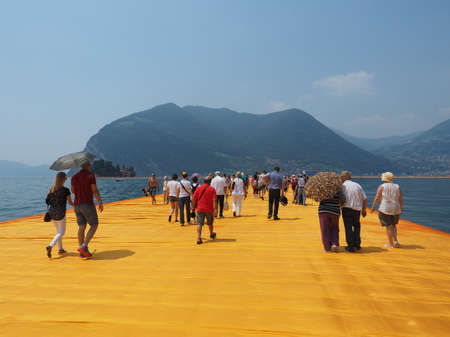 LAKE ISEO, ITALY - CIRCA JUNE 2016: The Floating Piers site specific landscape artwork by Christo and Jeanne Claudeのeditorial素材
