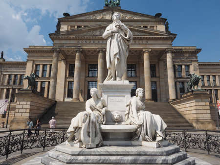 BERLIN, GERMANY - CIRCA JUNE 2016: Friedrich Schiller monument in front of Konzerthaus Berlin concert hall on the Gendarmenmarkt square in central Mitte districtのeditorial素材