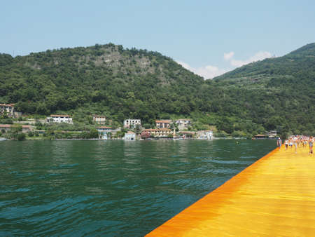 LAKE ISEO, ITALY - CIRCA JUNE 2016: The Floating Piers site specific landscape artwork by Christo and Jeanne Claudeのeditorial素材