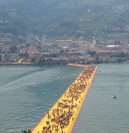 LAKE ISEO, ITALY - CIRCA JUNE 2016: The Floating Piers site specific landscape artwork by Christo and Jeanne Claudeのeditorial素材