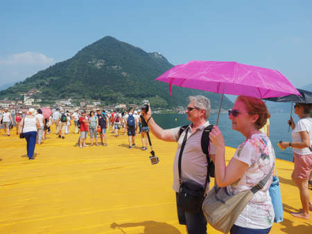 LAKE ISEO, ITALY - CIRCA JUNE 2016: The Floating Piers site specific landscape artwork by Christo and Jeanne Claudeのeditorial素材