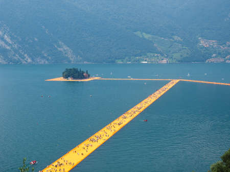 LAKE ISEO, ITALY - CIRCA JUNE 2016: The Floating Piers site specific landscape artwork by Christo and Jeanne Claudeのeditorial素材