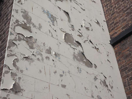 Detail of a damaged weathered wall paint