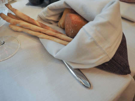 Bread and breadsticks on a table with copy space