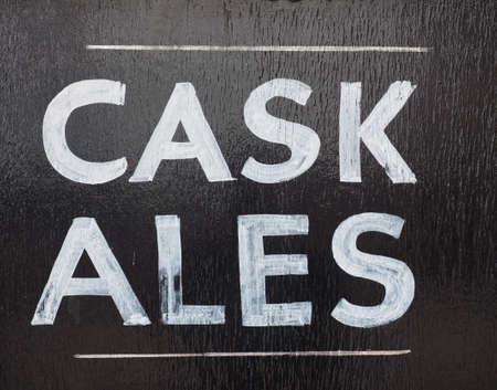 Cask ales sign outside a British pub serving real ale