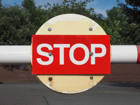 Warning signs,  Stop traffic sign in white over redの写真素材