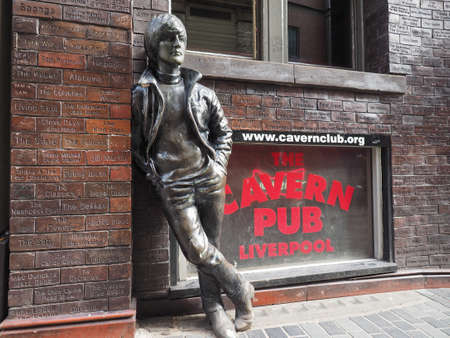 LIVERPOOL, UK - CIRCA JUNE 2016: The Wall of Fame at the Cavern Pub opposite the Cavern Club where The Beatles played, with a statue of John Lennonのeditorial素材