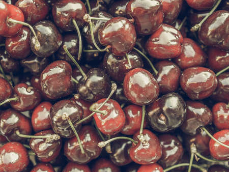 Vintage desaturated Red cherry fruits healthy vegetarian diet foodの写真素材