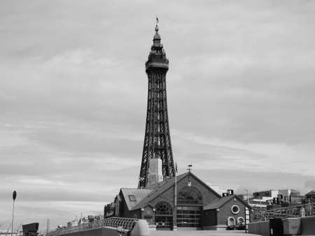 BLACKPOOL, UK - CIRCA JUNE 2016: Blackpool Tower on Blackpool Pleasure Beach resort amusement park on the Fylde coast in black and whiteのeditorial素材