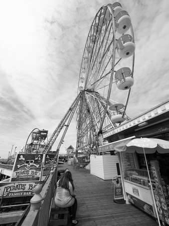 BLACKPOOL, UK - CIRCA JUNE 2016: Ferris wheel at Blackpool Pleasure Beach resort amusement park in black and whiteのeditorial素材