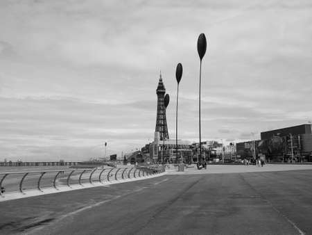 BLACKPOOL, UK - CIRCA JUNE 2016: Blackpool Pleasure Beach resort and Blackpool Tower on the Fylde coast in Lancashire in black and whiteのeditorial素材
