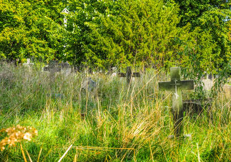High dynamic range HDR Graves and crosses and stones at old gothic cemetery in London, UKの写真素材