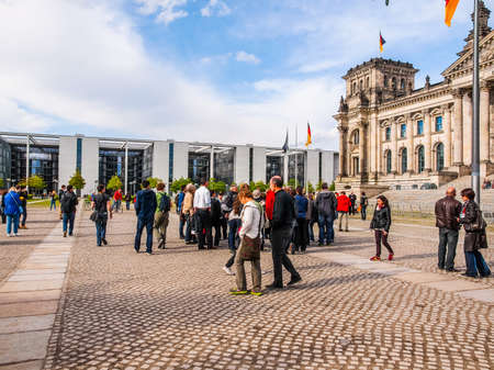 BERLIN, GERMANY - MAY 09, 2014: People visiting the Band des Bundes complex of government buildings near the Reichstag (German parliament) build in 1995 following the reunification of Germany (HDR)のeditorial素材