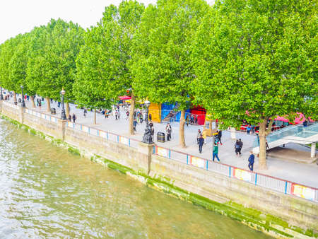 LONDON, UK - JUNE 09, 2015: People walking on the South Bank of Thames River (HDR)のeditorial素材
