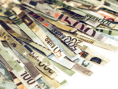 Vintage looking Money to burn - banknotes cut with a paper shredderの写真素材