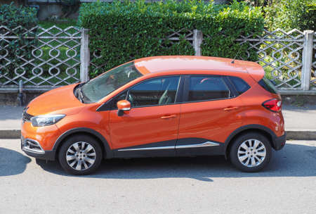 MILAN, ITALY - CIRCA SEPTEMBER 2016: Orange Renault Captur urban crossover carのeditorial素材