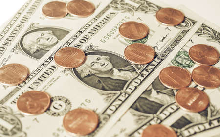 Vintage looking One cent coins and One Dollar banknotes  currency of the United States useful as a...