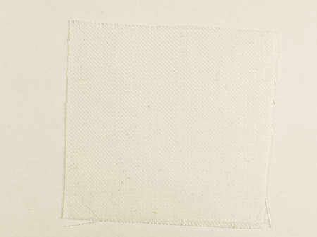 Vintage looking White fabric swatch over white background