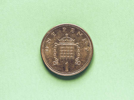 Vintage looking British Pound coin currency of the United Kingdom - One Pennyの写真素材