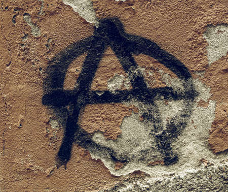 Vintage looking Symbol of Anarchy painted on a wallのeditorial素材