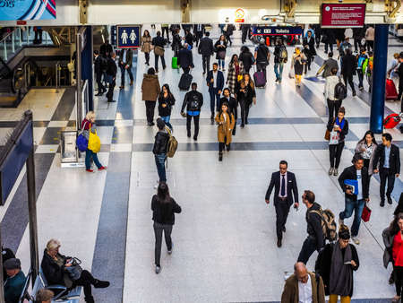LONDON, UK - SEPTEMBER 28, 2015: Travellers at Liverpool Street Station (HDR)のeditorial素材