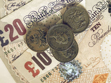 Vintage looking Detail of British Pounds banknotes and coinsの写真素材
