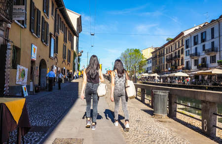 MILAN, ITALY - CIRCA APRIL 2016: Tourists on the bank of Naviglio Grande canal waterway (HDR)のeditorial素材