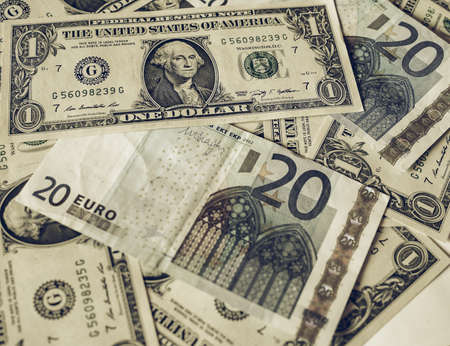 Vintage looking Mixed banknotes Euro and Dollars useful as a backgroundの写真素材