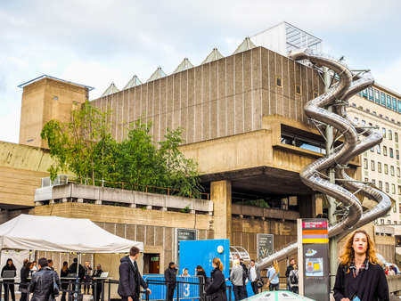 LONDON, UK - JUNE 09, 2015: People walking on the South Bank of Thames River (HDR)