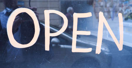 Open sign label tag on a store frontの写真素材