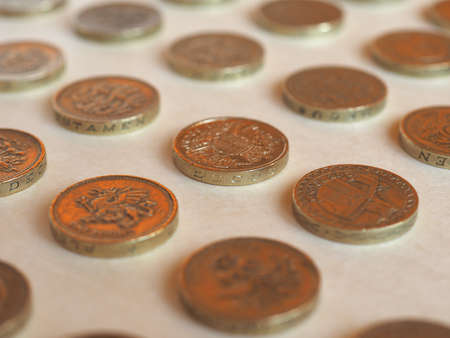 Array of Pound (GBP) coin, currency of United Kingdom (UK) - Perspective with selective focus