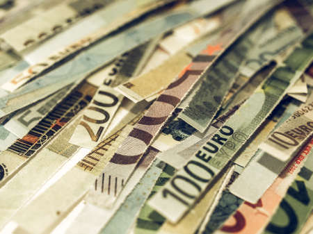 Vintage looking Money to burn - banknotes cut with a paper shredderの写真素材