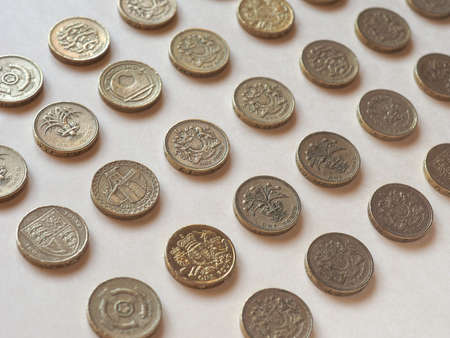 Array of Pound (GBP) coin, currency of United Kingdom (UK) - Perspective with selective focusの写真素材