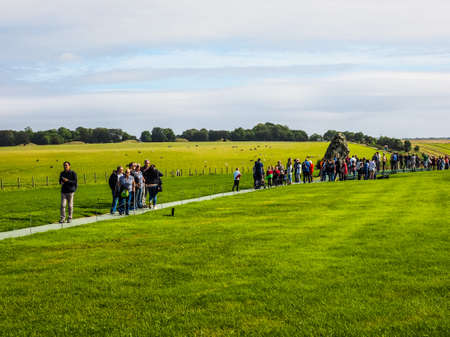 WILTSHIRE, ENGLAND, UK - CIRCA SEPTEMBER 2016: HDR Tourists visiting ruins of Stonehenge prehistoric...
